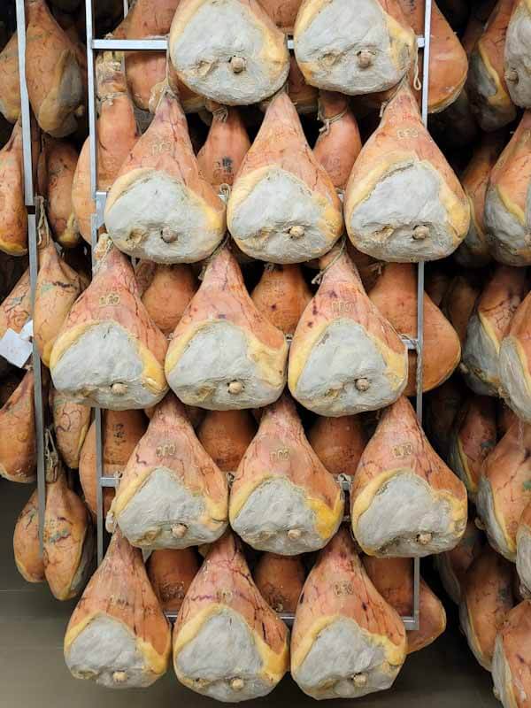 legs of parma ham or prosciutto di parma hanging