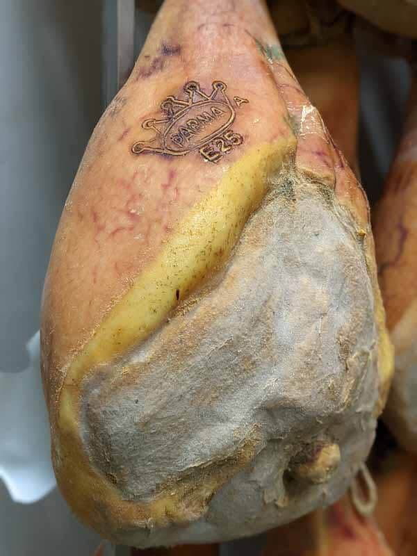 leg of parma ham with crown stamp