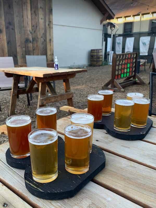 flight of beers on wooden table