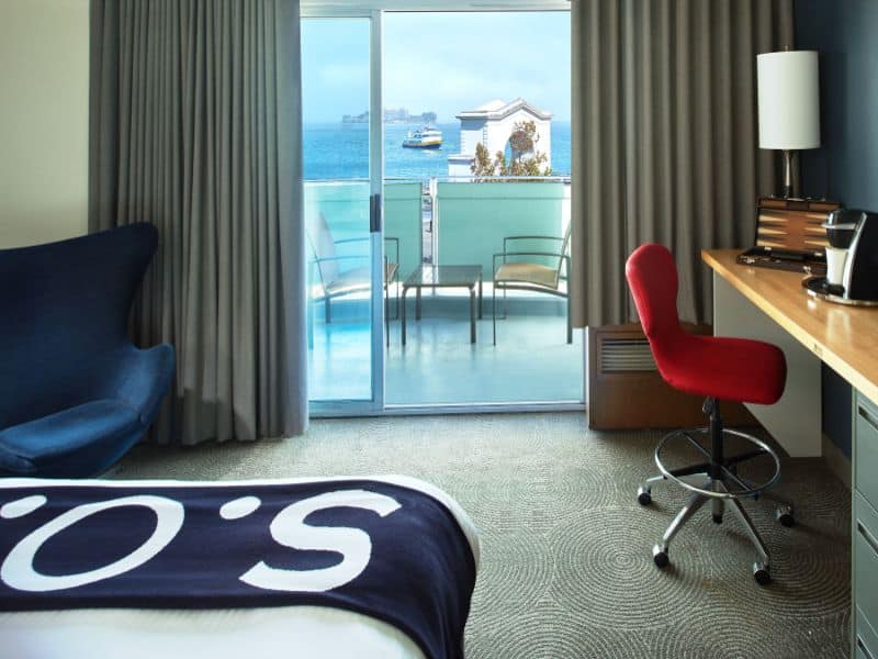 hotel room with balcony and ocean views