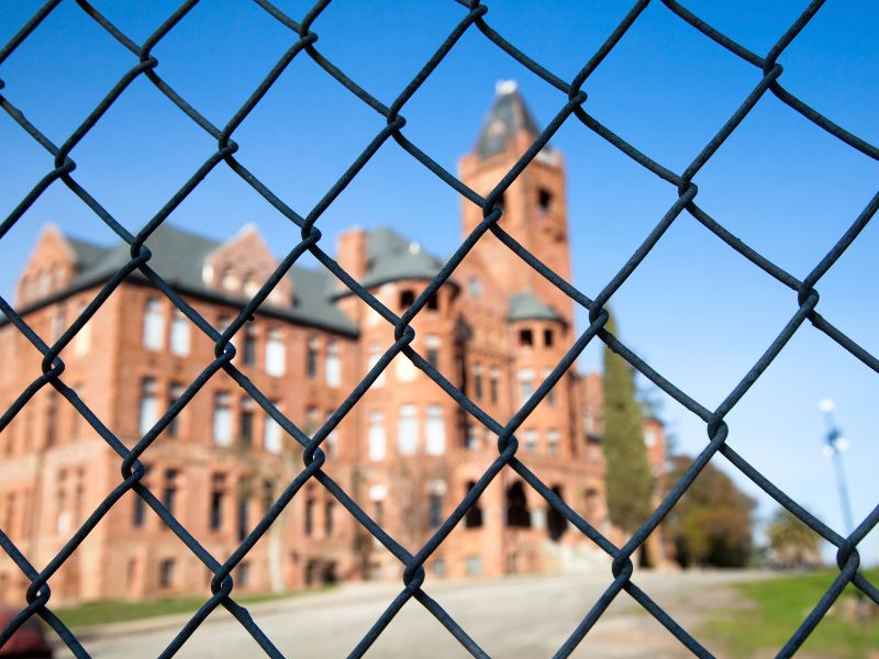 medieval castle seen through a fence